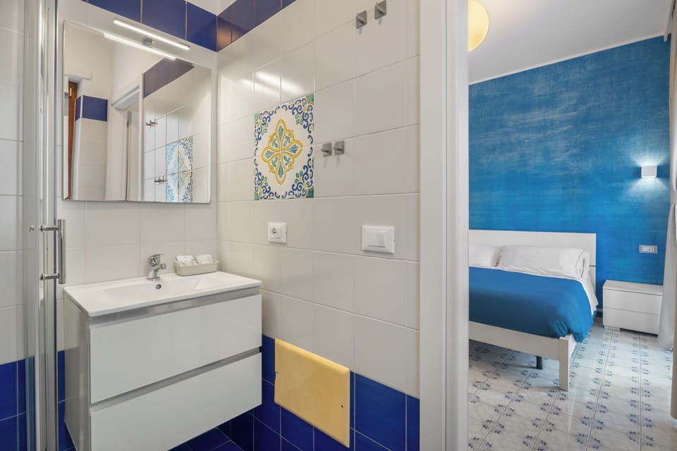 Deluxe Double Room, Balcony | Bathroom | Shower, rainfall showerhead, free toiletries, hair dryer