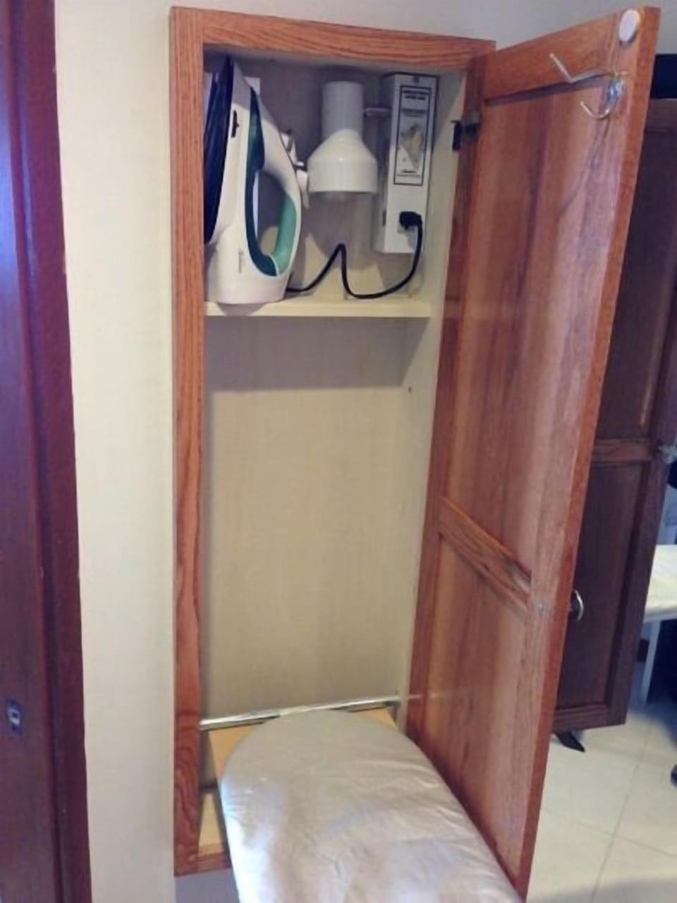 In-wall ironing board with light and electric hookup. No need to set up.