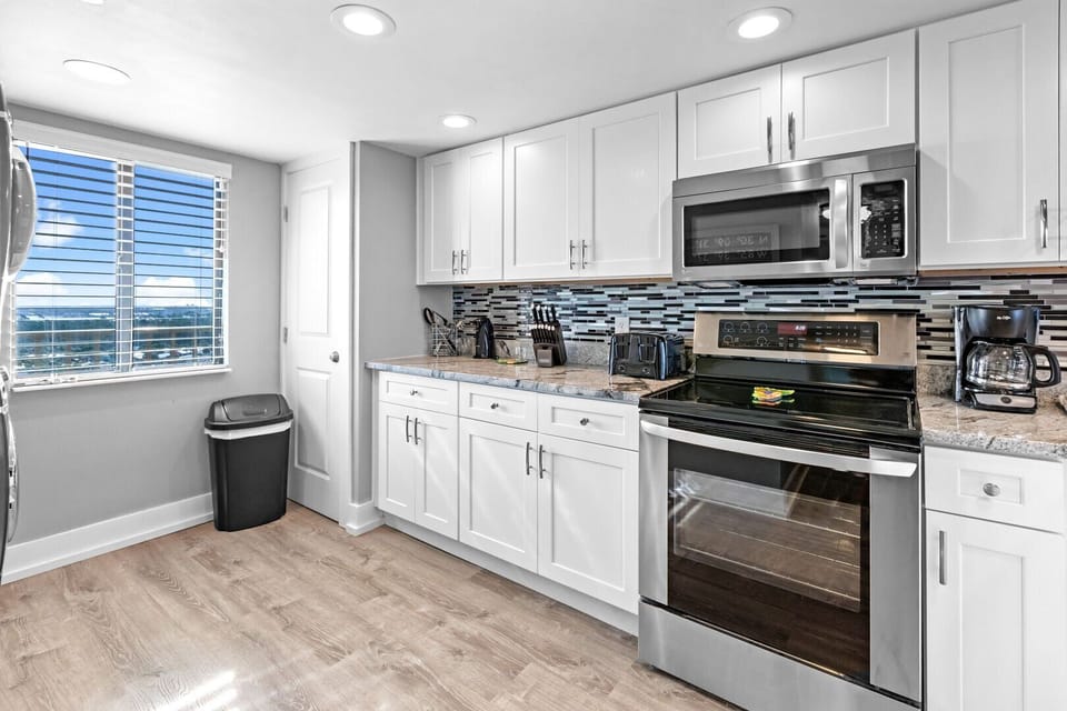 Gallery kitchen with new appliances.