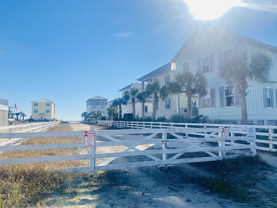 There is a cross walk light for easy crossing the road to our beach access road 