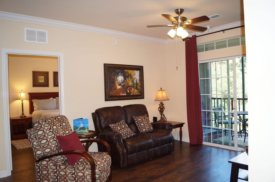 Family room with view into bedroom #2 and attached small screened porch.