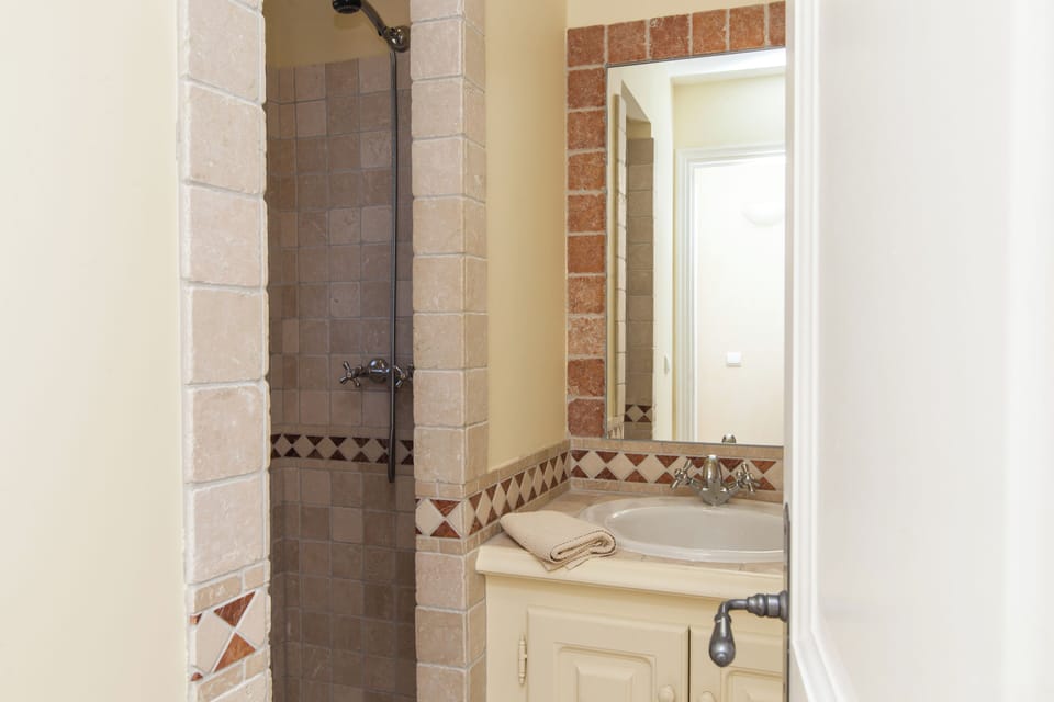 Separate tub and shower, designer toiletries, hair dryer, towels