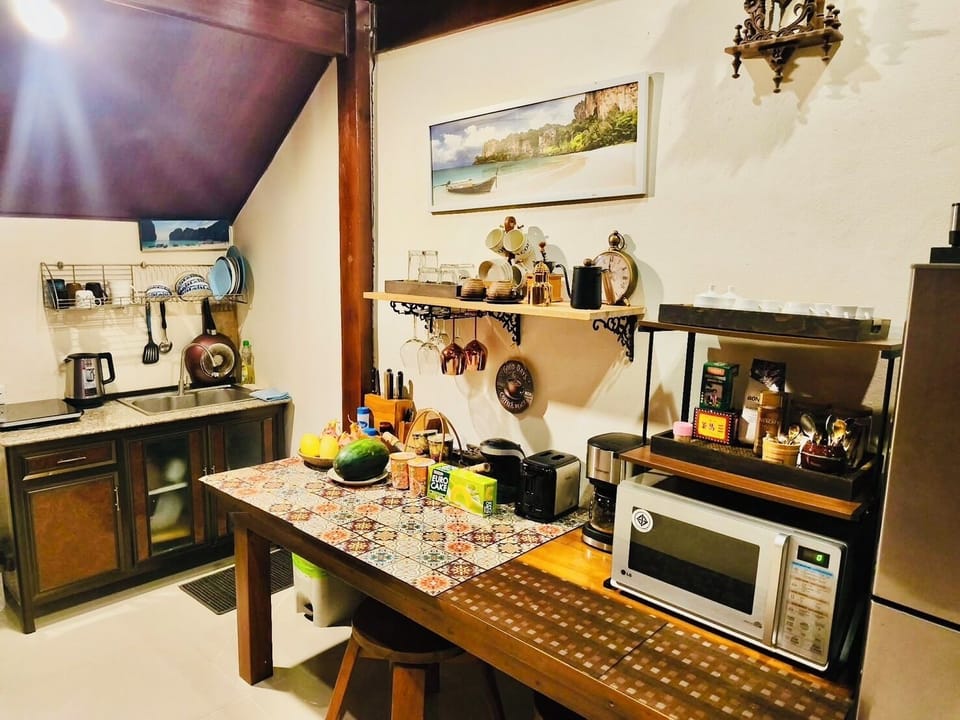 Full-size fridge, microwave, stovetop, coffee/tea maker