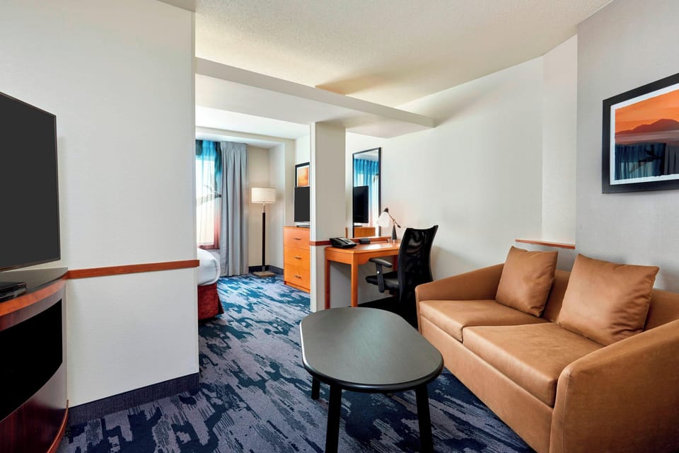 Suite, 1 King Bed (Living Area) | Living area | LCD TV, pay movies, MP3 dock