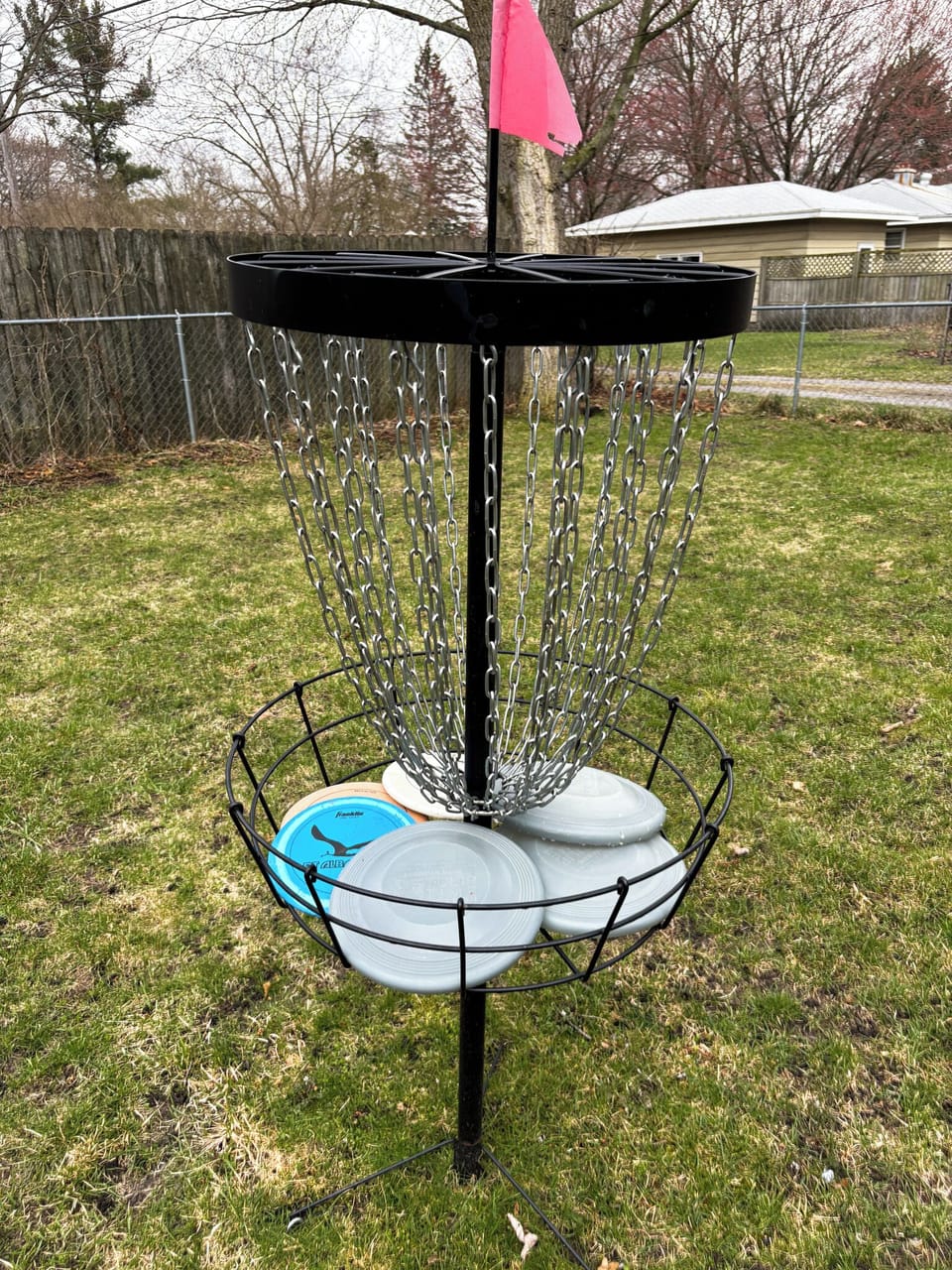 backyard is large and spacious with Frisbee golf gane 