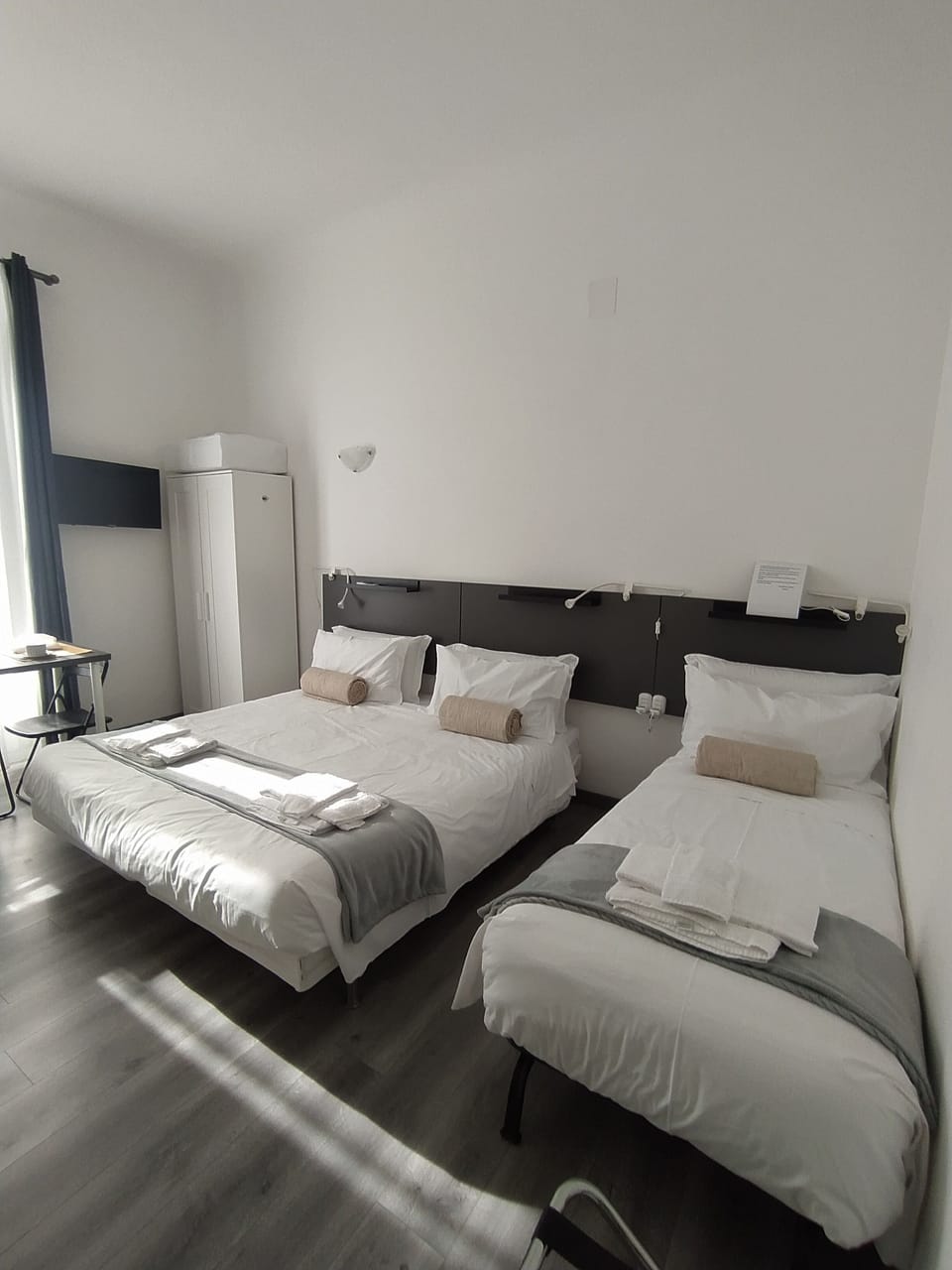 Deluxe Triple Room, Private Bathroom, City View | 4 bedrooms, down comforters, minibar, in-room safe