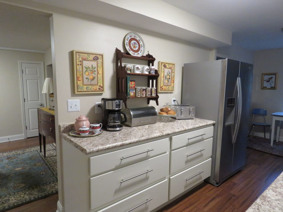Kitchen entails self closing drawers.