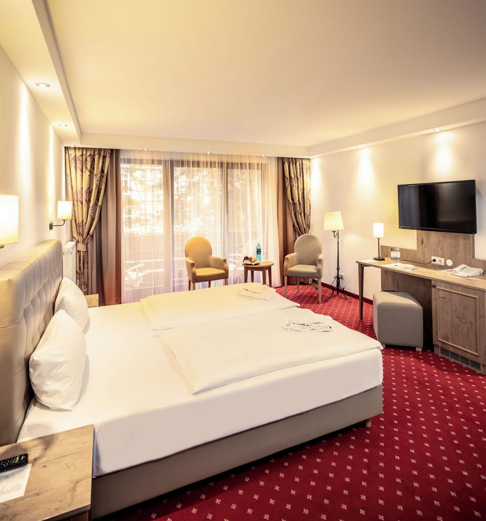 Superior Double Room | Minibar, in-room safe, desk, laptop workspace