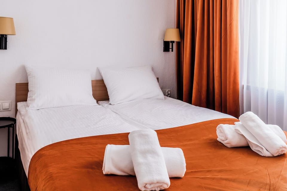 Junior Room, 2 Bathrooms | Desk, blackout drapes, iron/ironing board (on request), WiFi (free)