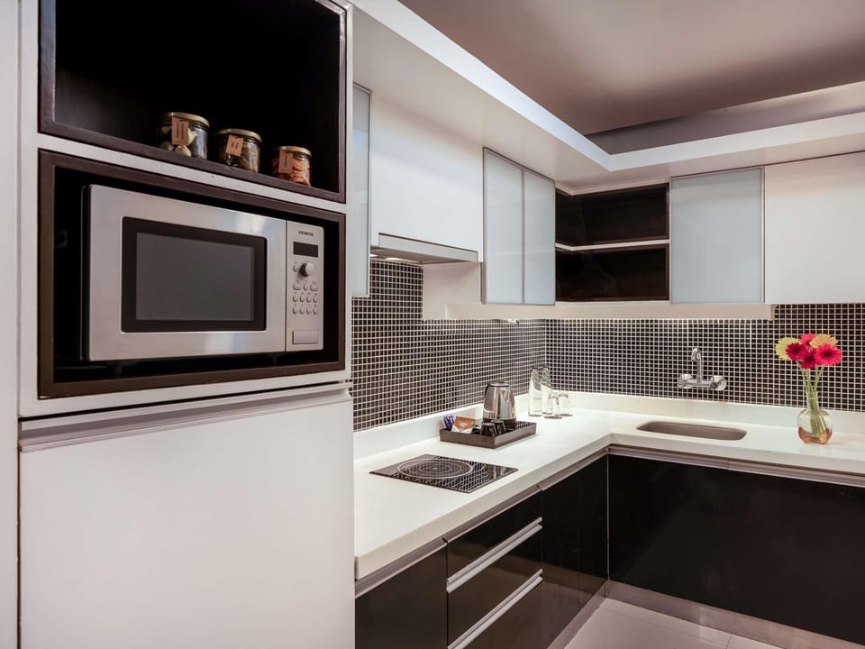 Executive Suite, 1 Bedroom, Balcony | Private kitchen | Coffee/tea maker, fridge, microwave, stovetop