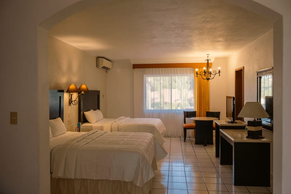 Executive Room, 2 Queen Beds | Desk, blackout drapes, iron/ironing board (on request), cribs (free)