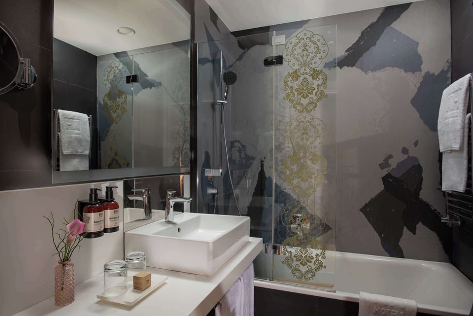 Eco-friendly toiletries, hair dryer, bidet, towels