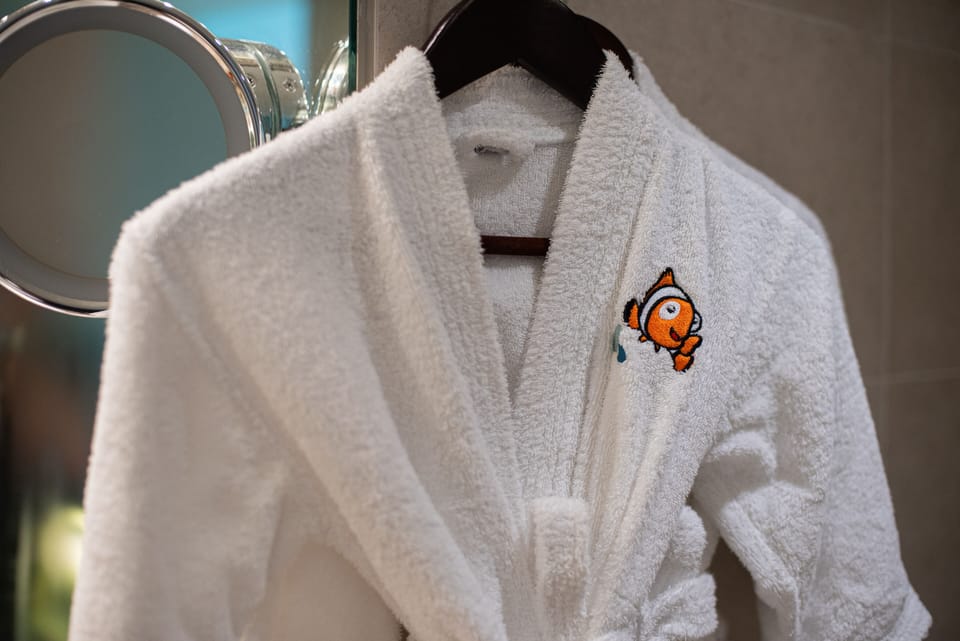 Family Room, 1 King Bed with Sofa bed (Clown Fish Themed) | Bathroom | Separate tub and shower, free toiletries, hair dryer, bathrobes