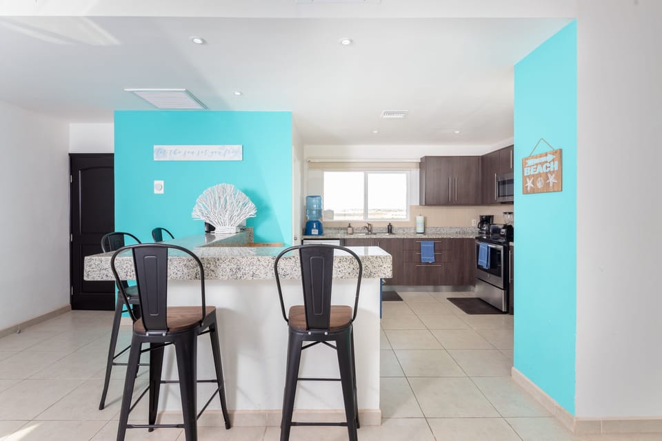 Breakfast by the kitchen. Main entrance is visible on the left.