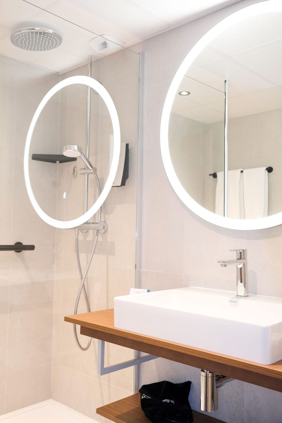 Shower, hair dryer, slippers, towels