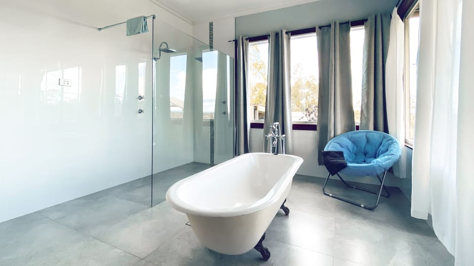 One of 3 bathrooms - free standing bath and double shower heads (ensuite)



