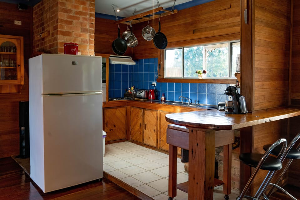 One of 2 kitchens . Fully stocked kitchen implements. And double size fridge. 