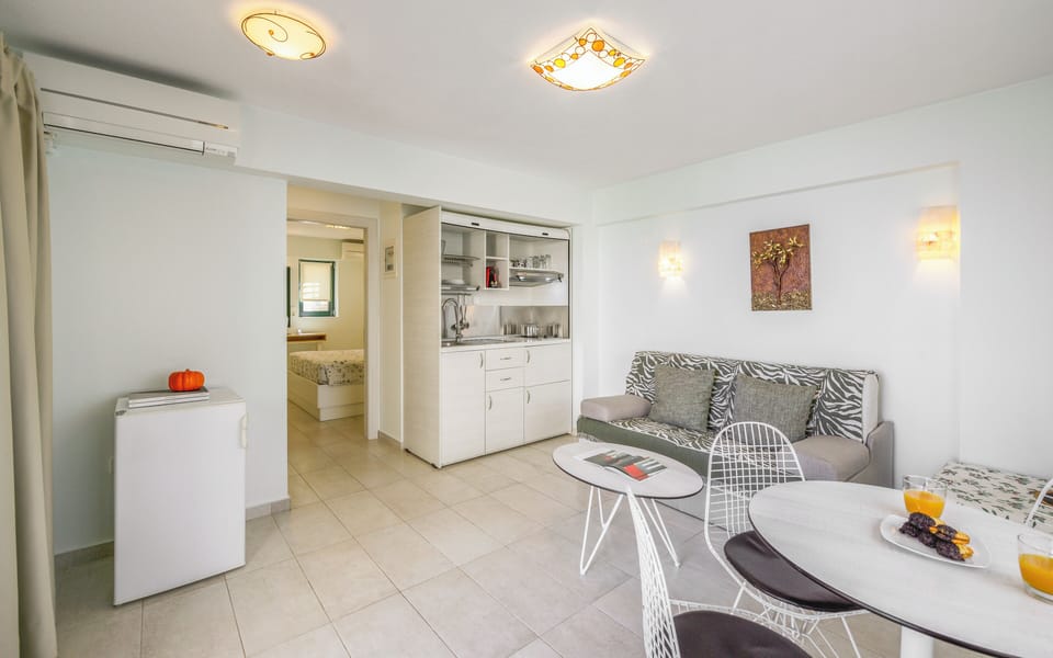 Deluxe Apartment, Sea View (Ground floor) | Living area | Flat-screen TV