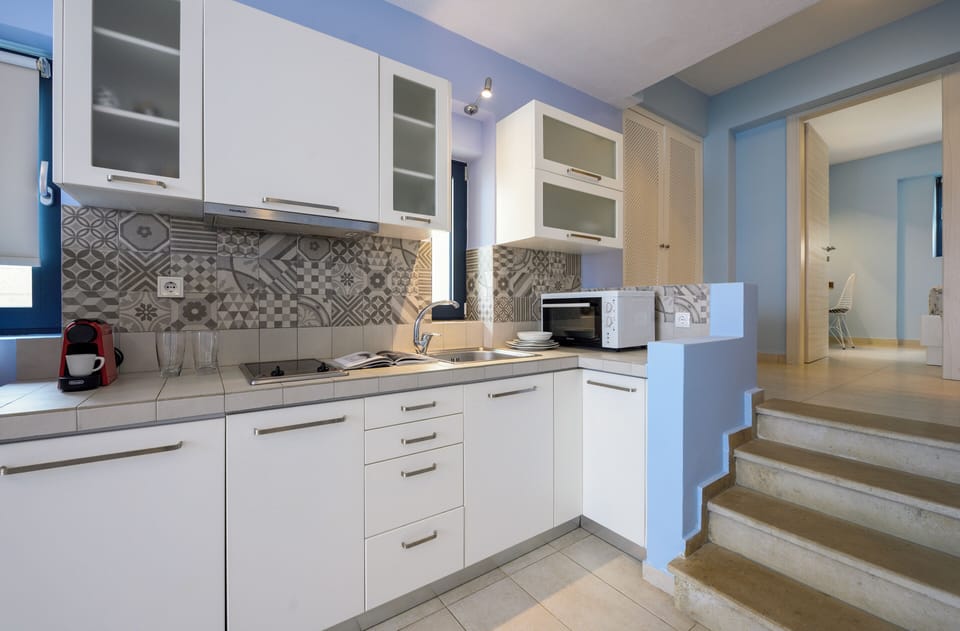Deluxe Apartment, Sea View (Ground floor) | Private kitchen | Fridge, microwave, stovetop, coffee/tea maker