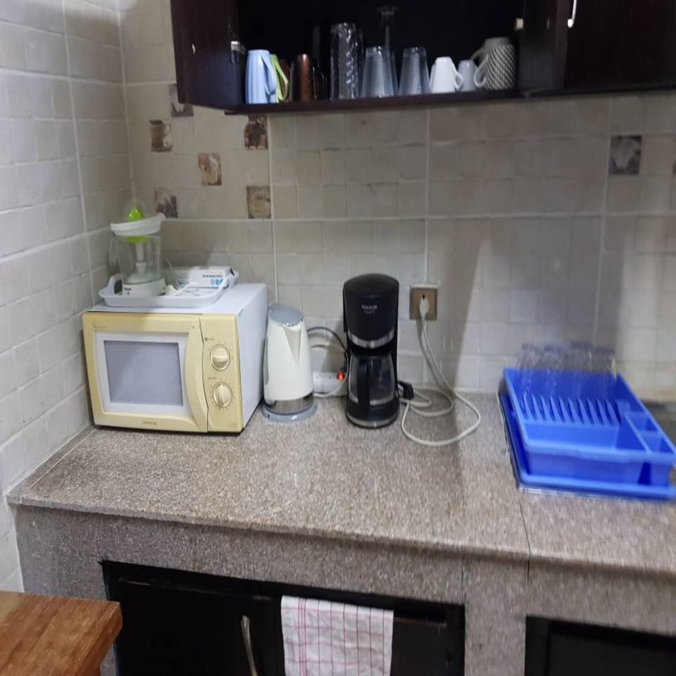 Apartment | Private kitchen | Coffee/tea maker, full-size fridge, microwave, oven