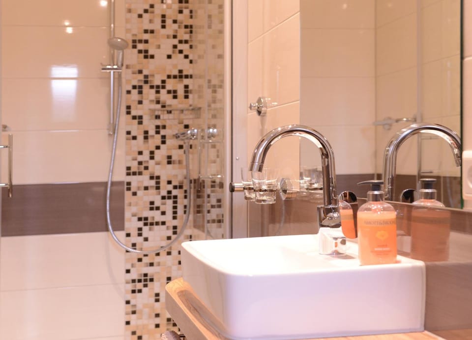 Shower, deep soaking tub, hair dryer, towels