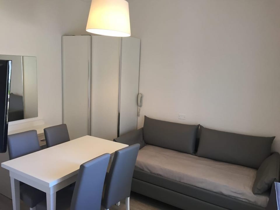 Suite, Multiple Beds, Connecting Rooms | Living area | Flat-screen TV