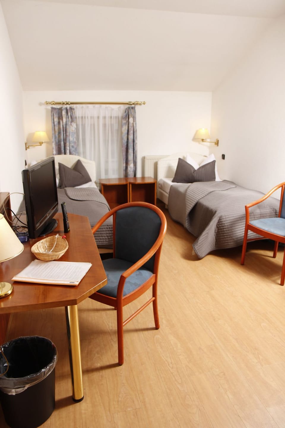 Hypo-allergenic bedding, desk, laptop workspace, blackout drapes