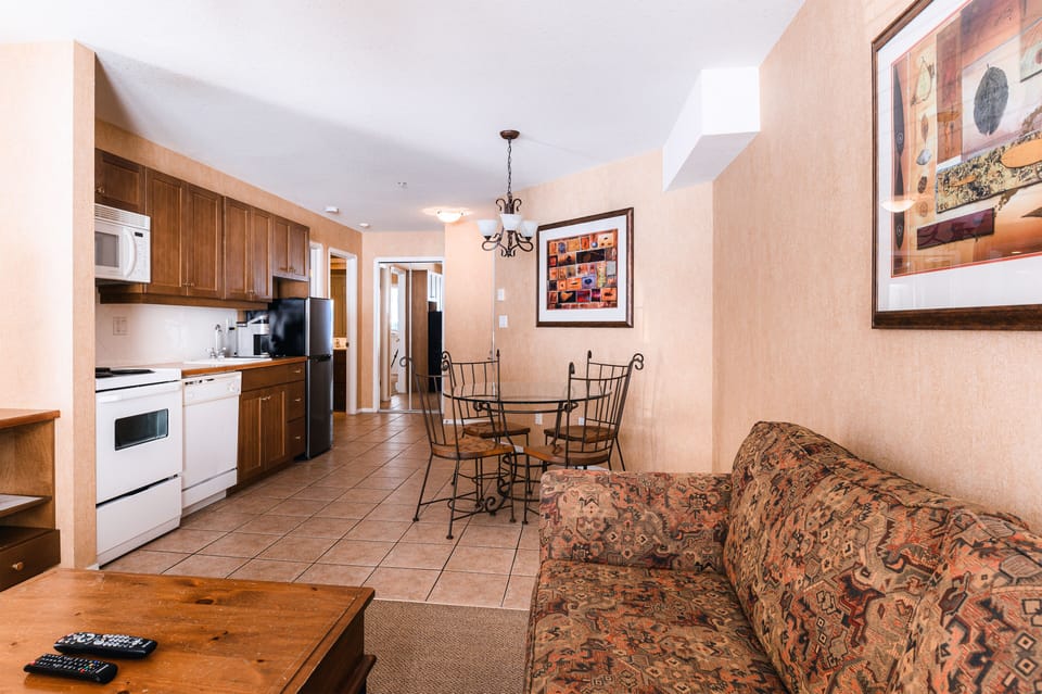 Standard Suite, 1 Bedroom, Balcony | Living area | 50-inch flat-screen TV with satellite channels, TV, fireplace
