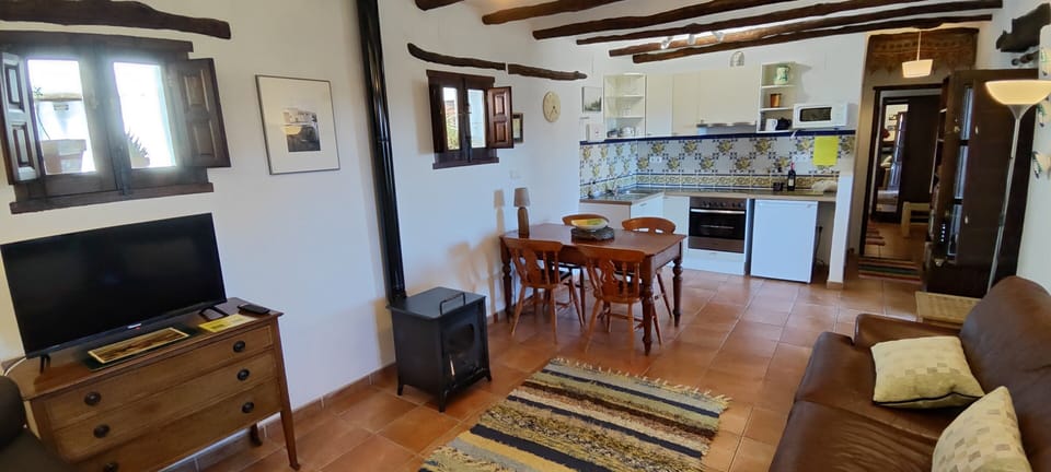 Under floor heating supplemented by a wood burning stove - if necessary.