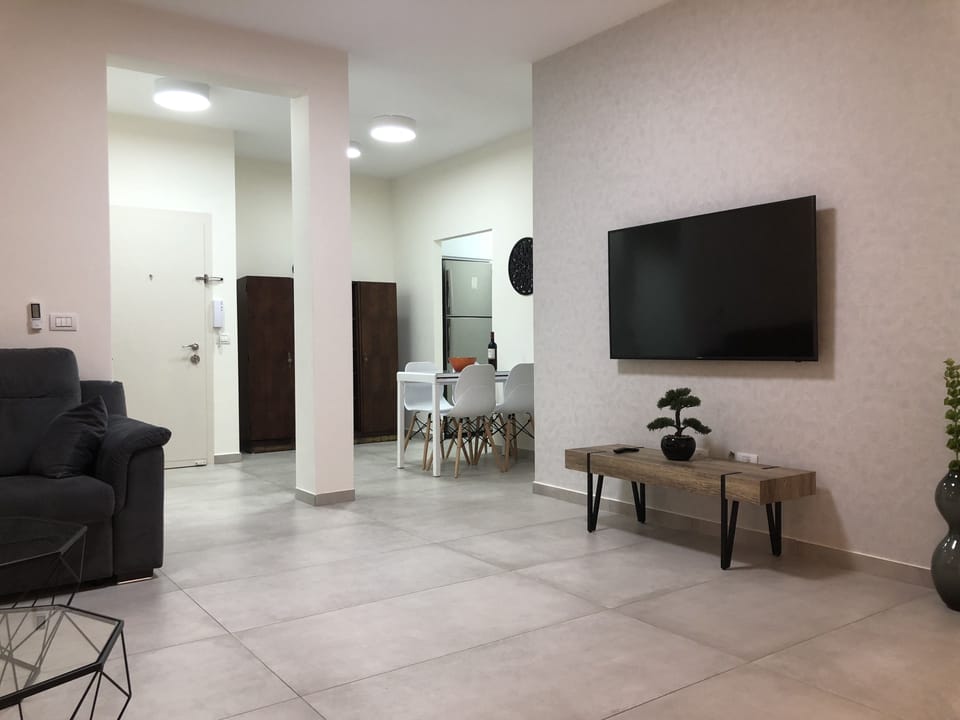 Deluxe Apartment, 3 Bedrooms | Living area | Flat-screen TV