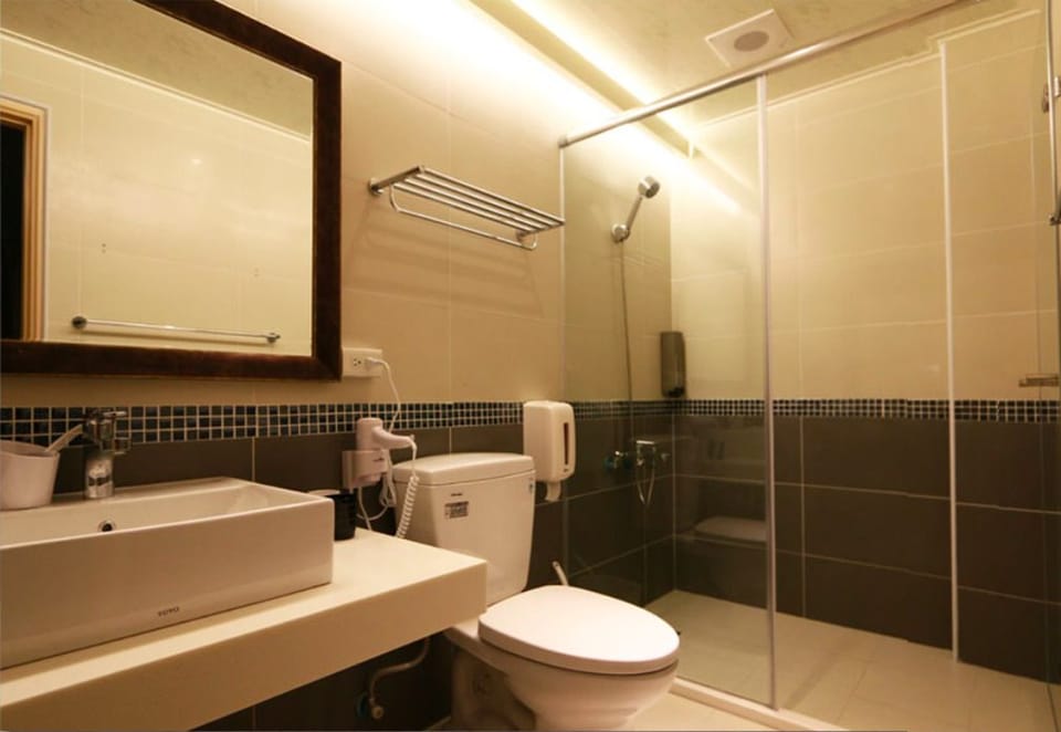 Basic Suite, 2 Double Beds | Bathroom | Shower, rainfall showerhead, hair dryer, slippers