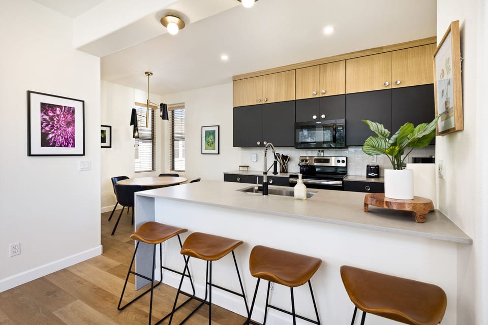 Dining area, breakfast bar, and kitchen