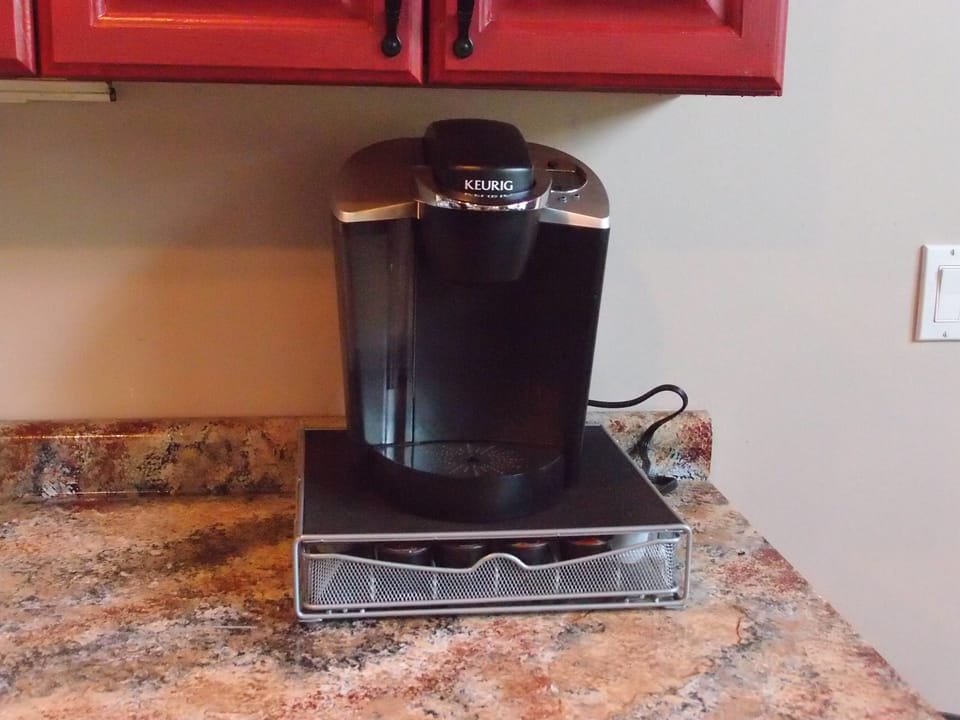 Keurig coffee maker with K-Cup organizer stand (we include a dozen starter pods)