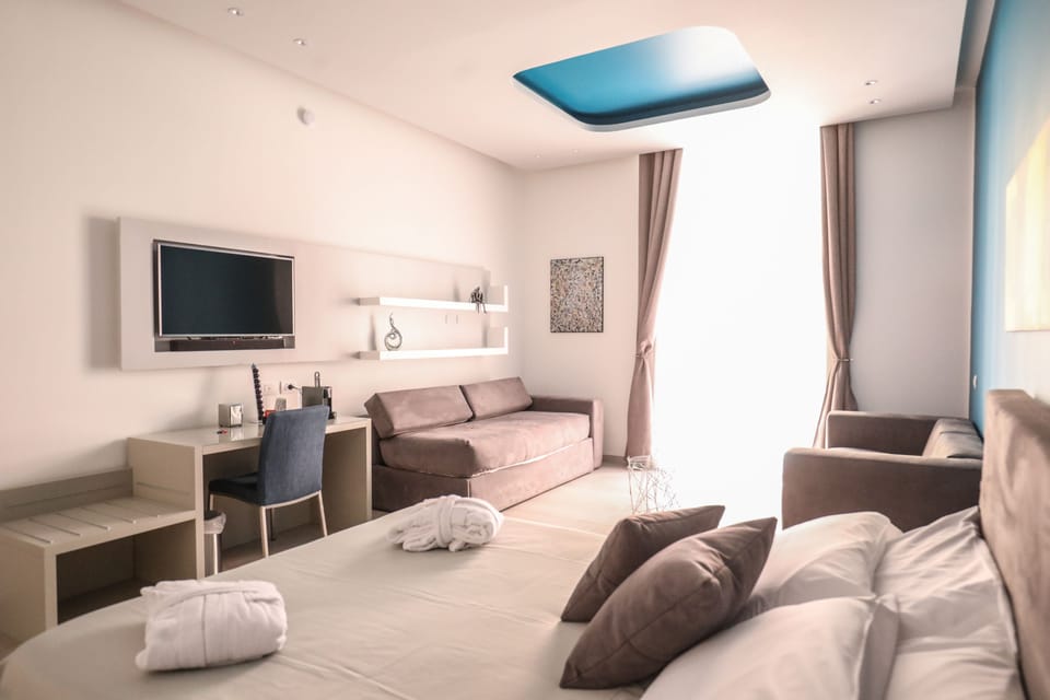 City Suite, Non Smoking, City View | Premium bedding, down comforters, in-room safe, individually decorated
