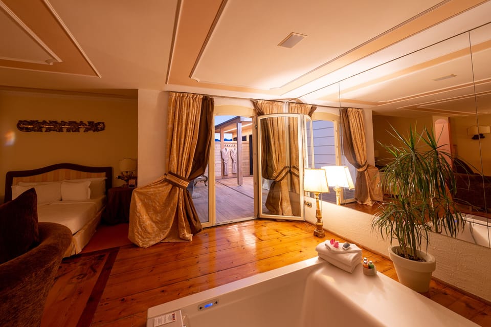 Junior Double Room | Living area | 42-inch Smart TV with digital channels, TV