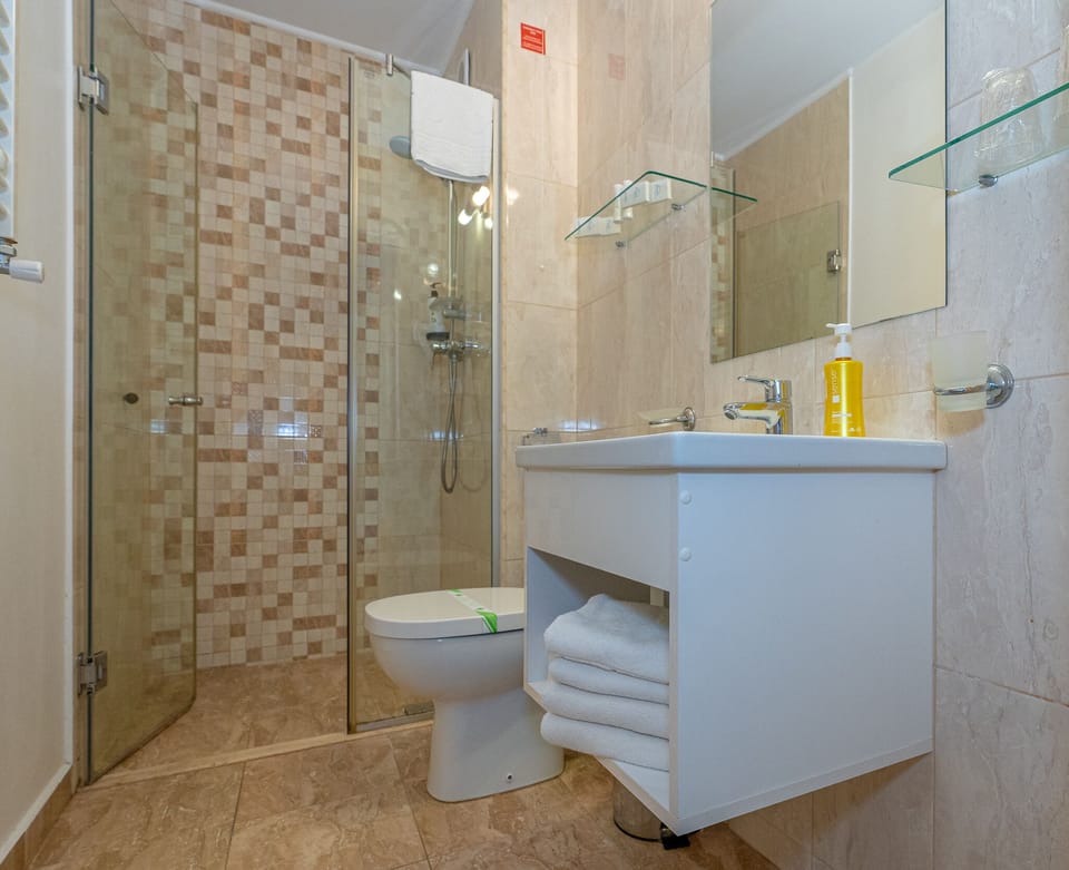 Shower, free toiletries, slippers, towels