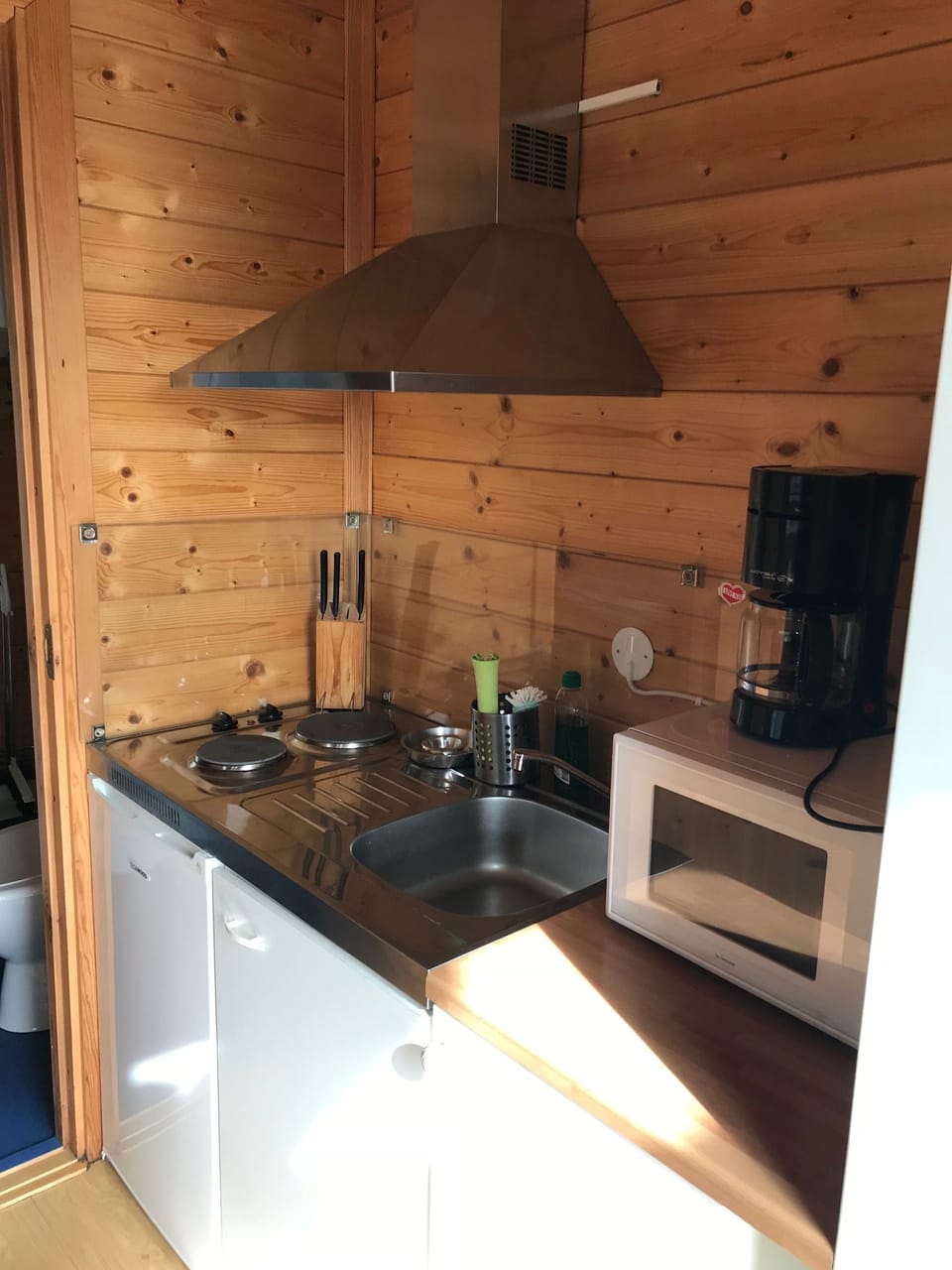 Cabin | Private kitchenette | Fridge, stovetop, cookware/dishes/utensils, dining tables