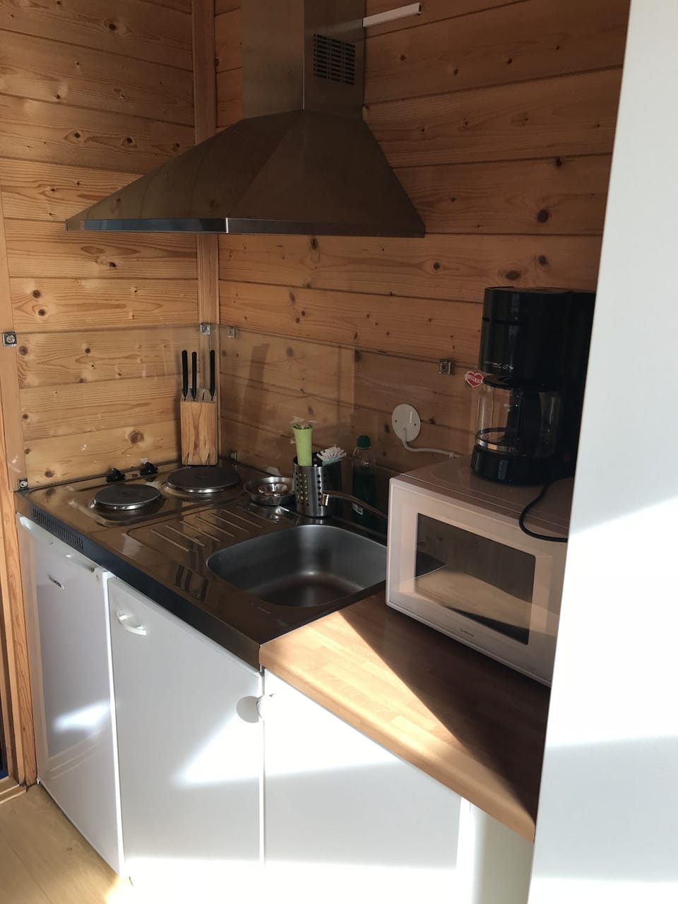 Cabin | Private kitchenette | Fridge, stovetop, cookware/dishes/utensils, dining tables