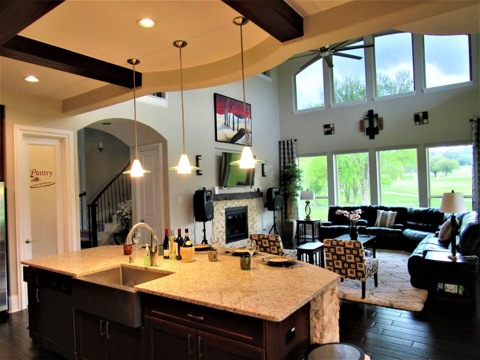 Kitchen/Living Room Overlooking the Golf Course. Fireplace Off.