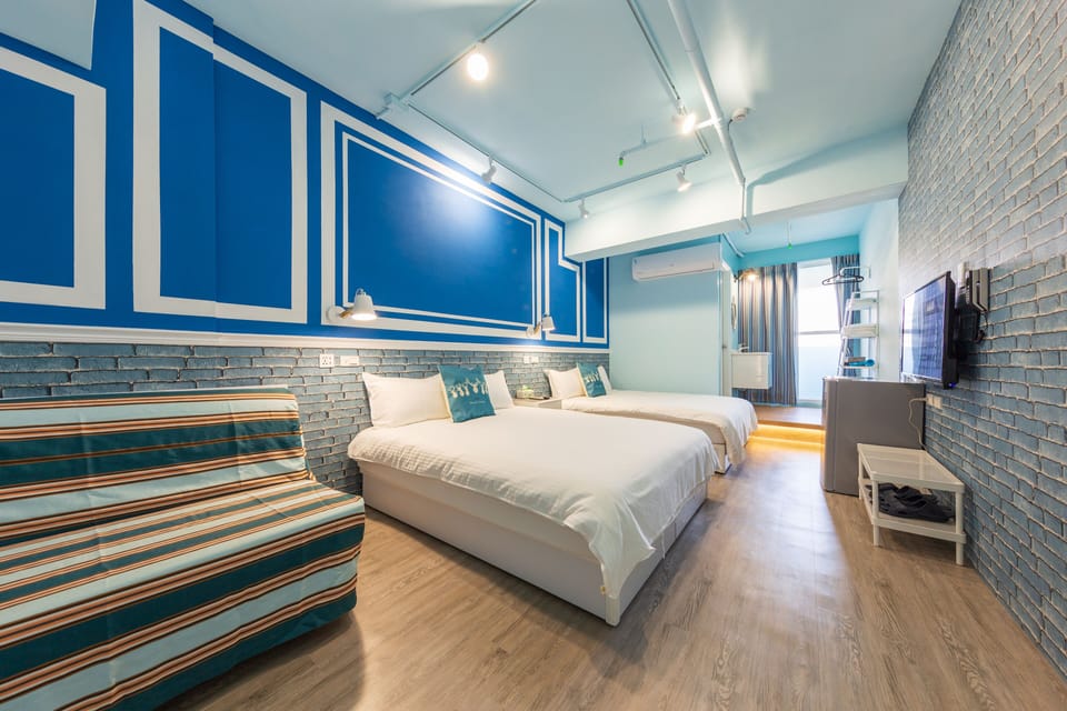 Deluxe Quadruple Room, Balcony, City View | Desk, blackout drapes, soundproofing, free WiFi