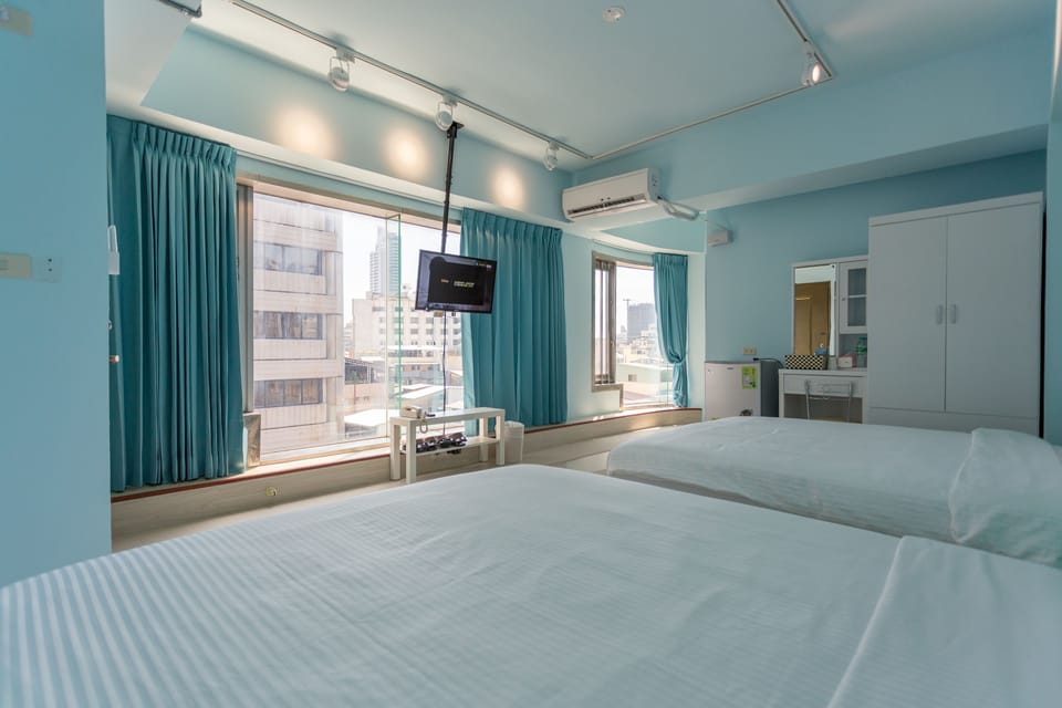 Deluxe Quadruple Room, Balcony, City View | Desk, blackout drapes, soundproofing, free WiFi