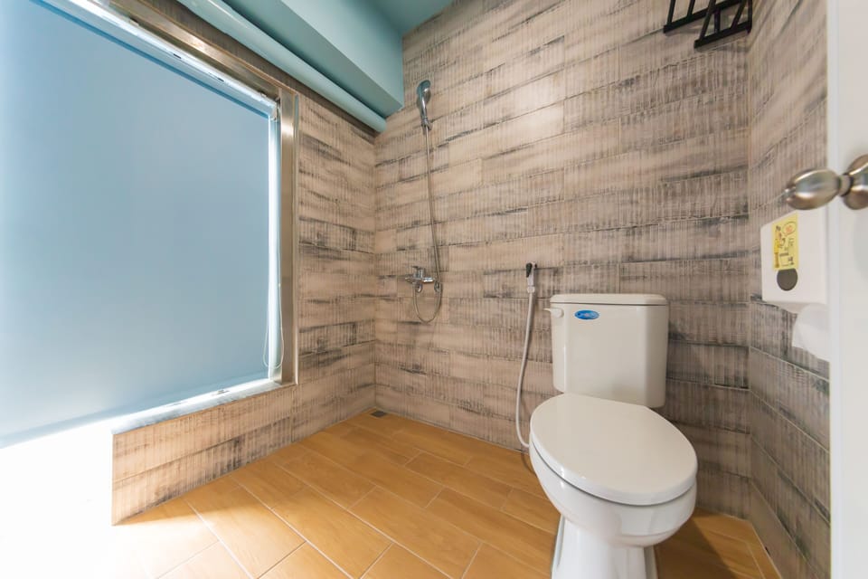 Deluxe Quadruple Room, Balcony, City View | Bathroom | Shower, hydromassage showerhead, free toiletries, hair dryer