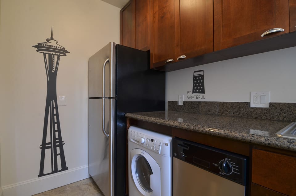 A combined washer/dryer, dishwasher and fridge round out the amenities.