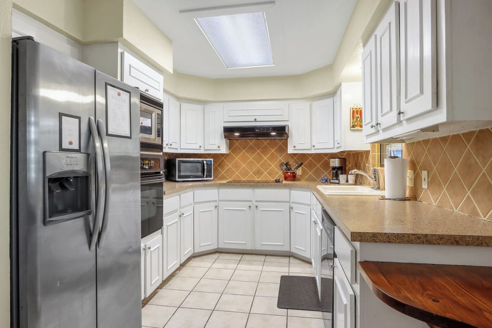 Full kitchen with lots of light and counter space.