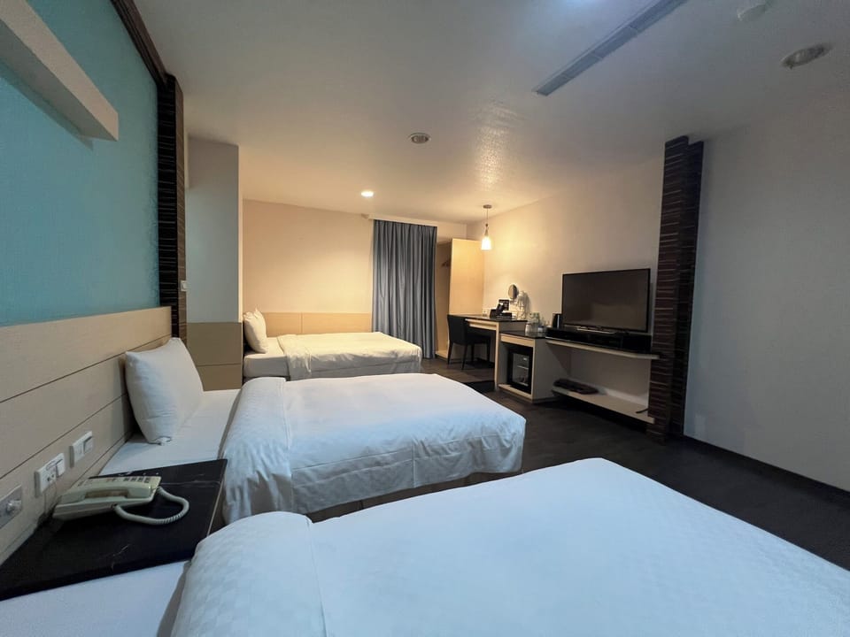 Family Quadruple Room, Non Smoking | Down comforters, desk, blackout drapes, free WiFi