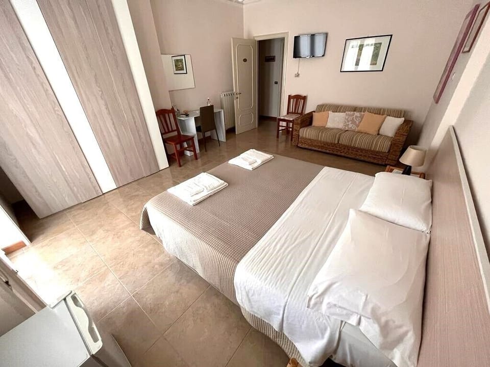 Comfort Quadruple Room, 1 Queen Bed with Sofa bed | Beach | Beach nearby