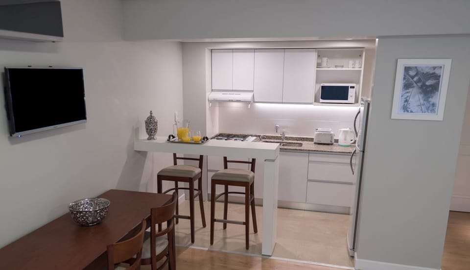 Full-size fridge, microwave, stovetop, toaster