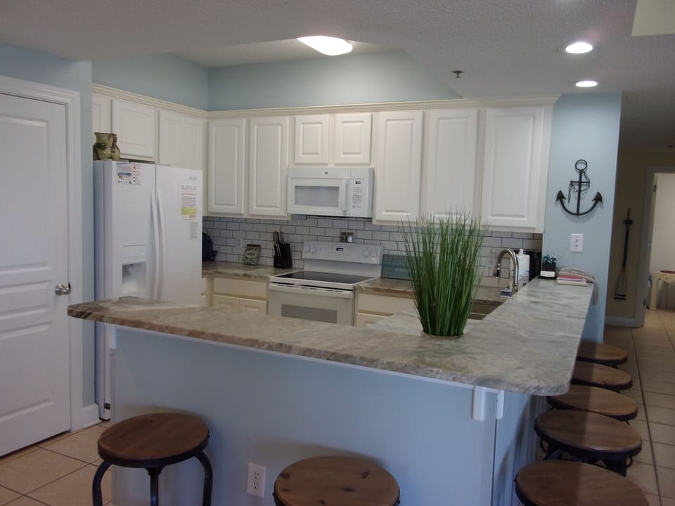 Kitchen with seating around the counter for 7.