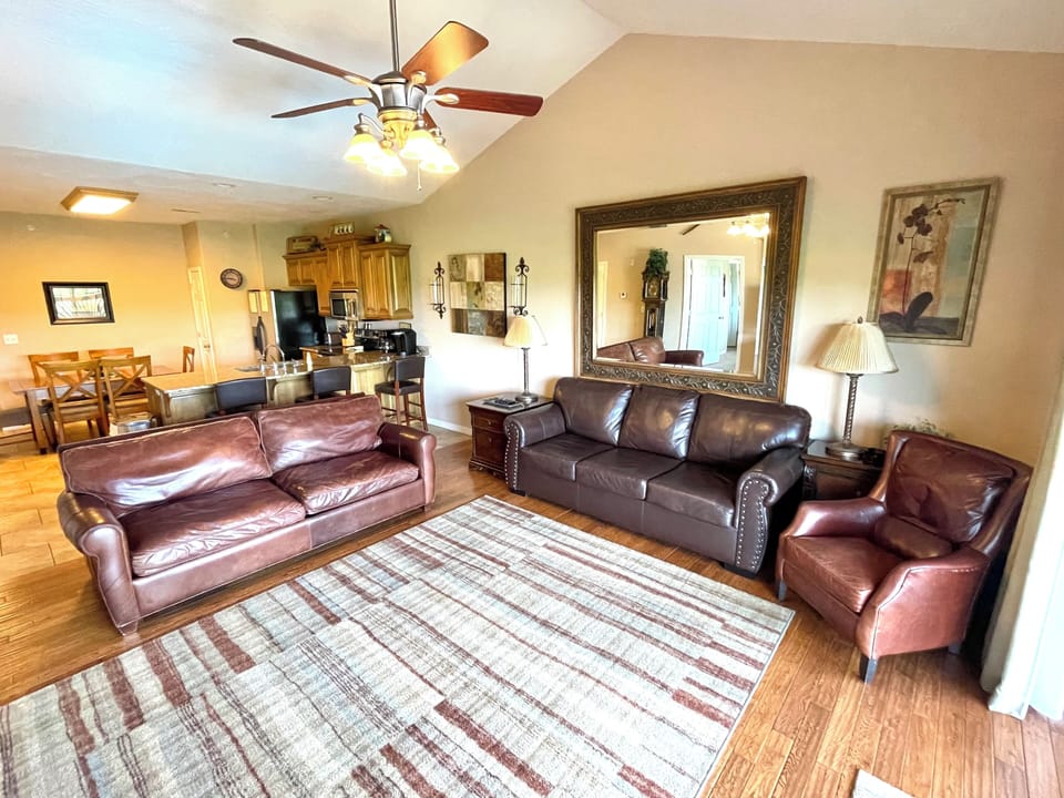 Spacious living room with a lake  and pool view. Sofa sleeper in the living room