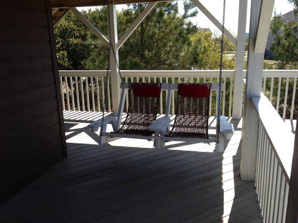 Outdoor swing facing the pool